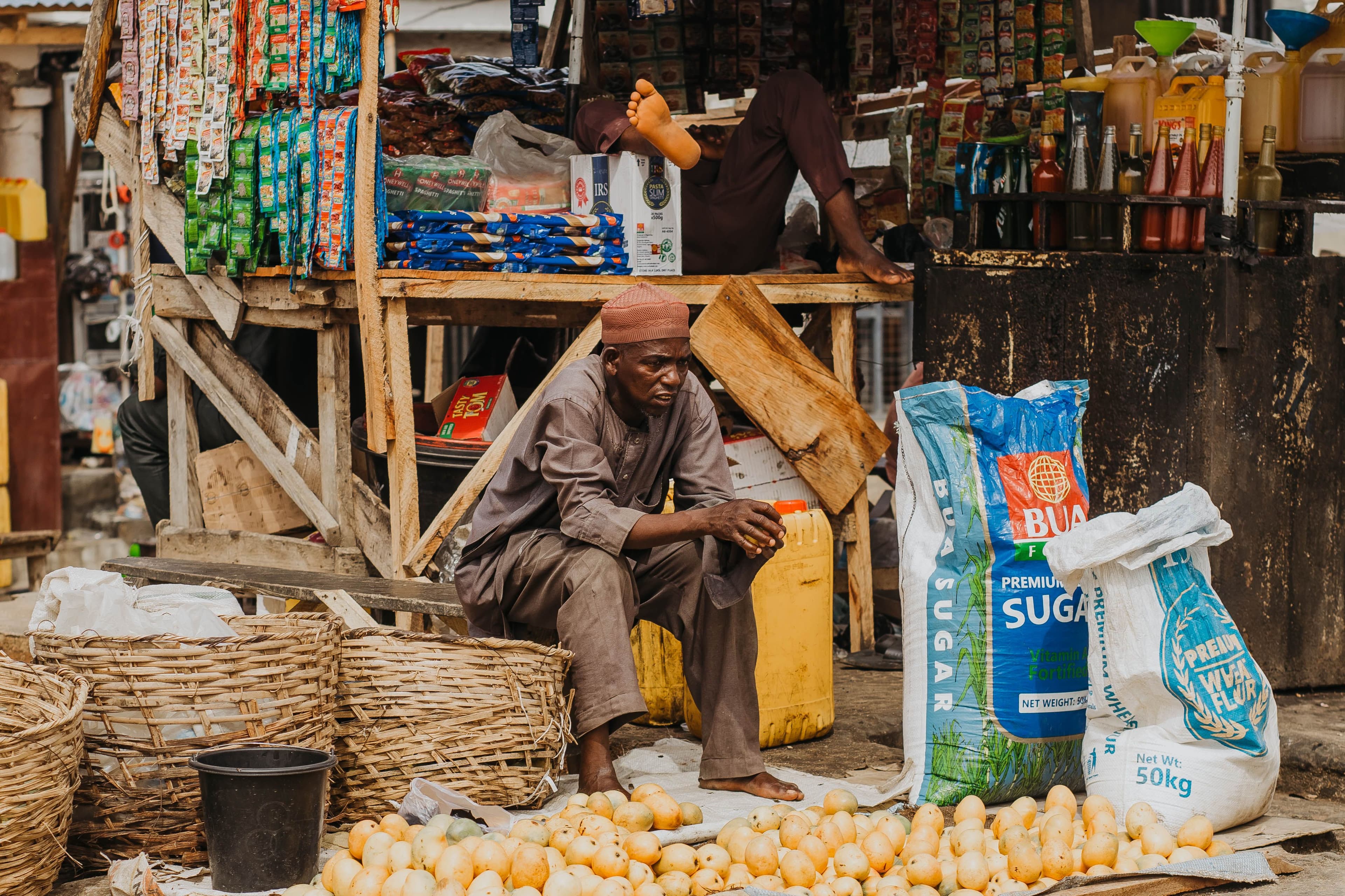 Shop owner with a customer at the counter